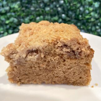 Gluten-free vegan cinnamon coffee cake slice with crumb topping