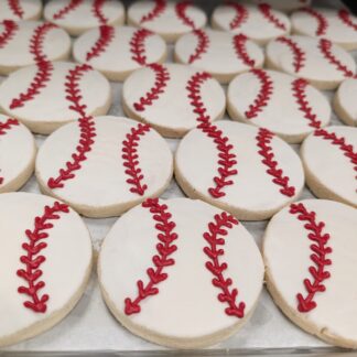 Gluten-free vegan shortbread cookies decorated like baseballs.